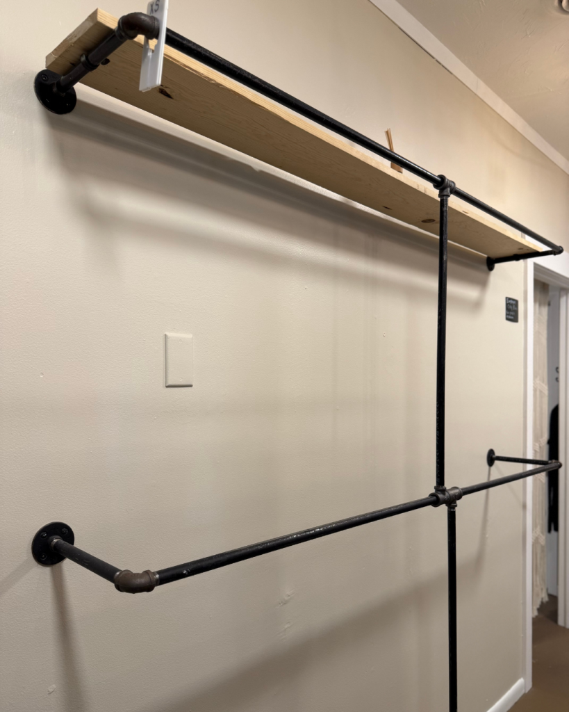 Empty rack from moving the clothing to the new location. We're super excited to have you all join us and experience The Roost elevated. 